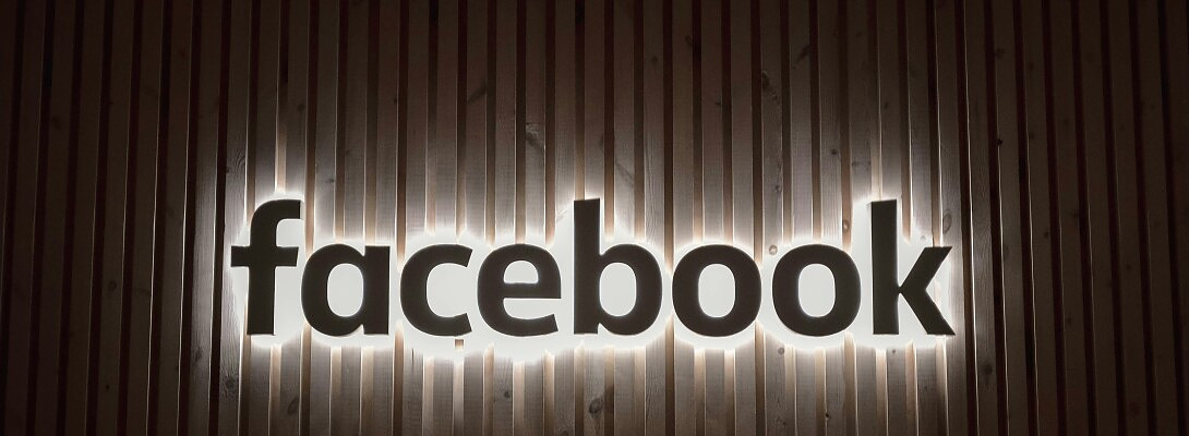 What is best way to refer people to your Facebook business page from your profile?